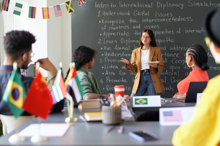 Teacher explaining material to students at lesson