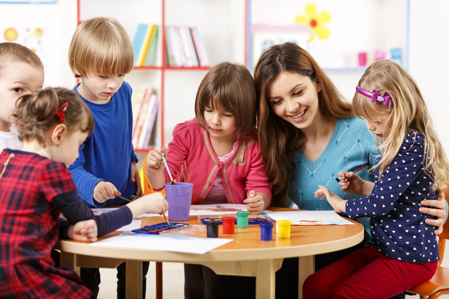 pre school teacher in a group